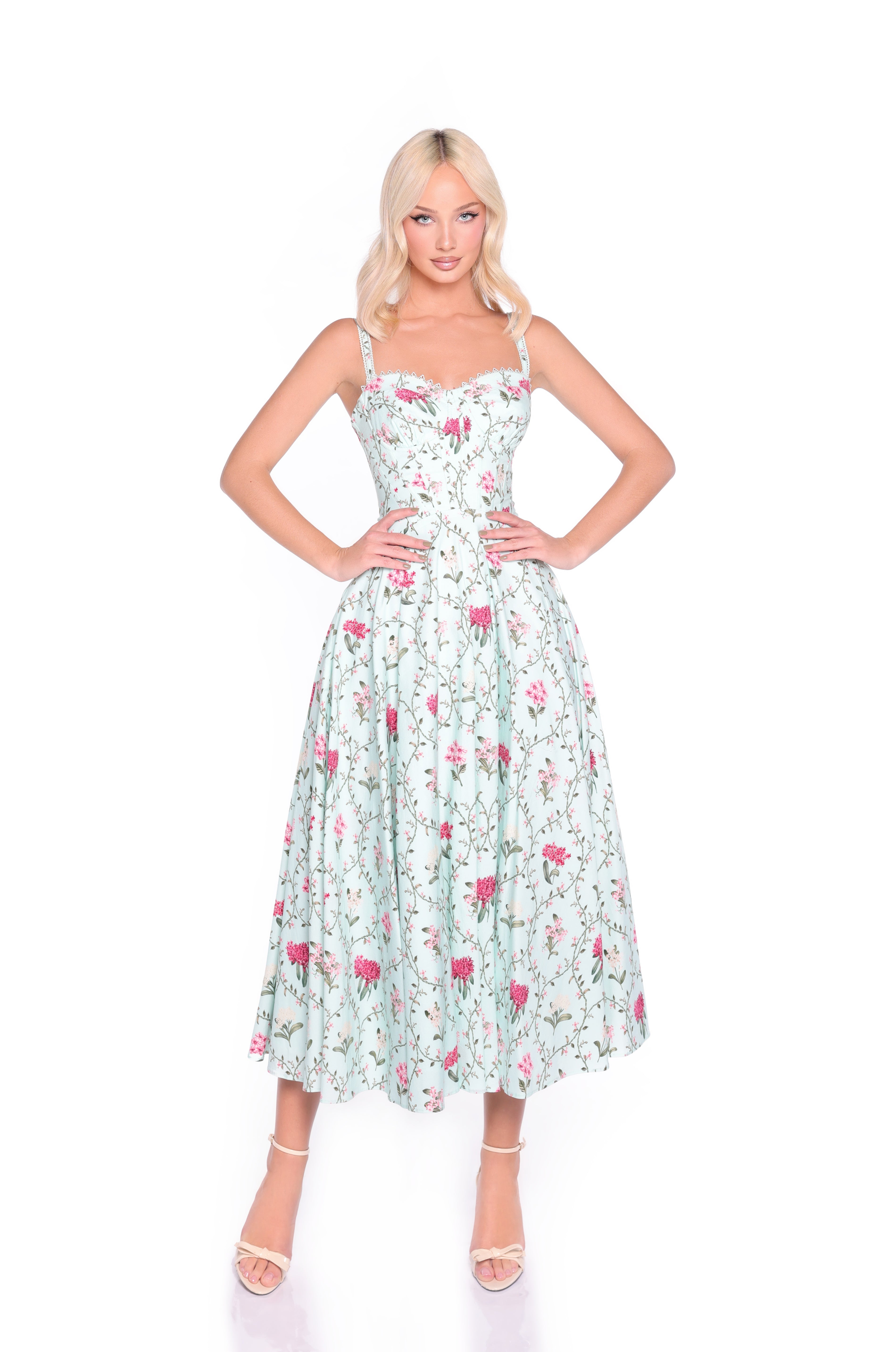 Woman standing with hands on hips, wearing the Mint Green Floral Casual Midi Dress: Rosella and strappy high-heeled sandals—perfect as a wedding guest dress—against a white background.